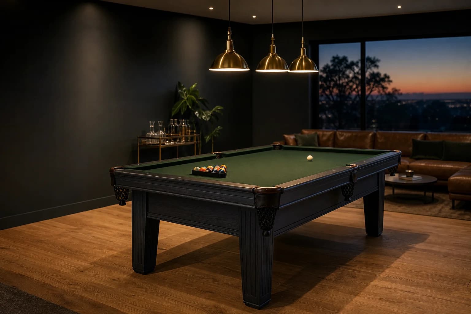 A slate pool table with green felt in a warmly lit home games room